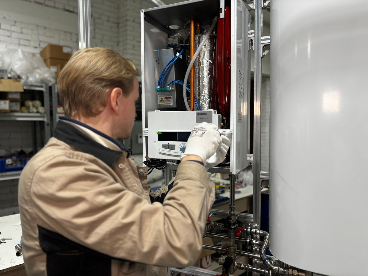 Certified installer servicing a water heater
